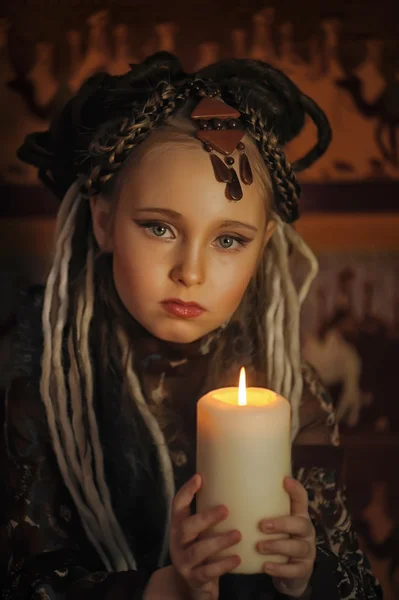 Girl with candles — Stock Photo, Image