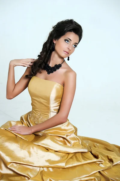 Girl in golden dress — Stock Photo, Image