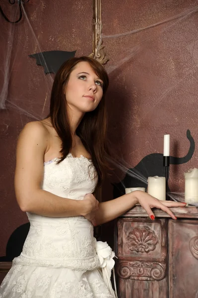 Beautiful girl in a spooky house — Stock Photo, Image