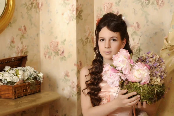 Portrait of a beautiful girl with flowers — Stock Photo, Image