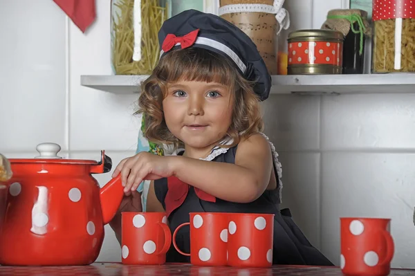 Portrait of a little girl in the kitchen — Stock Photo, Image