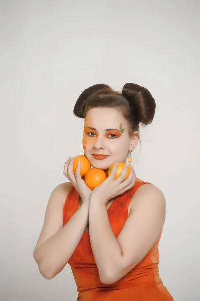 Girl in an orange dress — Stock Photo, Image