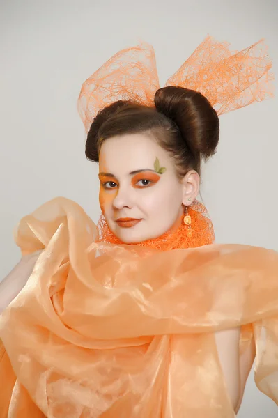 Girl in an orange dress — Stock Photo, Image