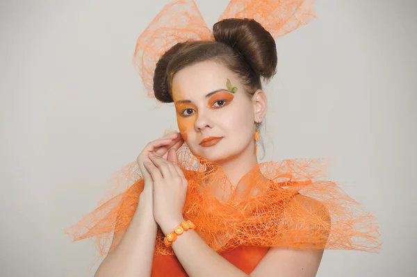 Girl in an orange dress — Stock Photo, Image