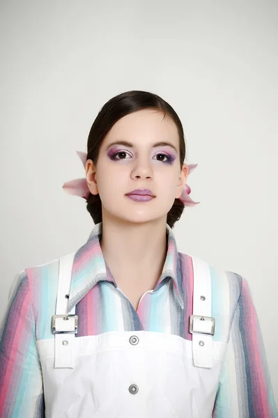 Portrait of a girl with a flower in her hair — Stock Photo, Image