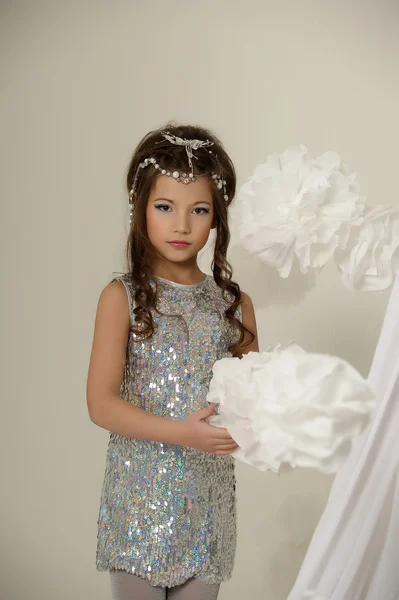 Portrait of a beautiful young girl in silver dress — Stock Photo, Image