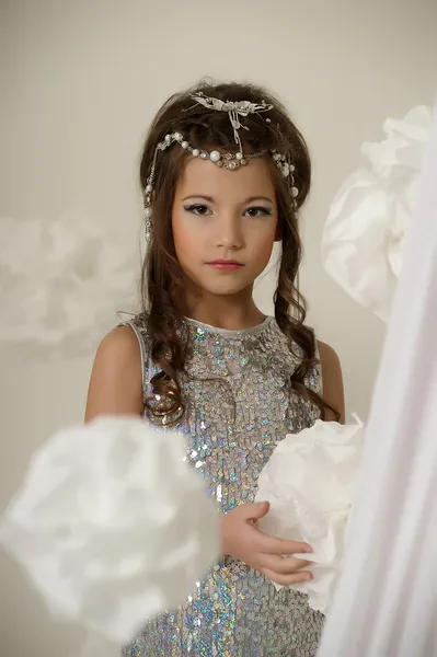 Portrait of a beautiful young girl in silver dress — Stock Photo, Image