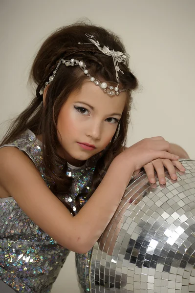 Portrait of a beautiful young girl in silver dress — Stock Photo, Image