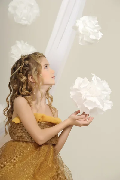 Portrait of a beautiful girl in a gold dress — Stock Photo, Image