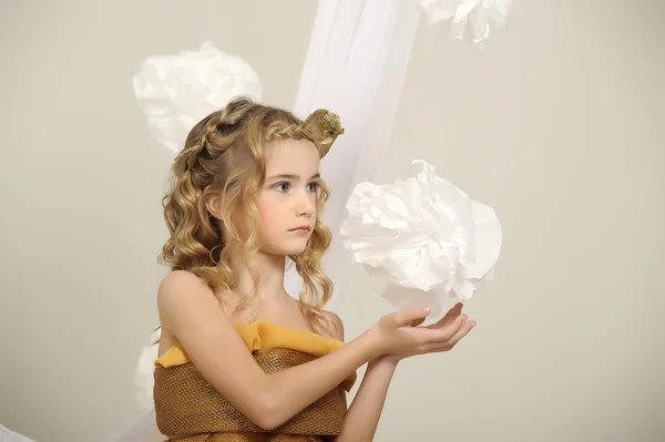 Portrait of a beautiful girl in a gold dress — Stock Photo, Image