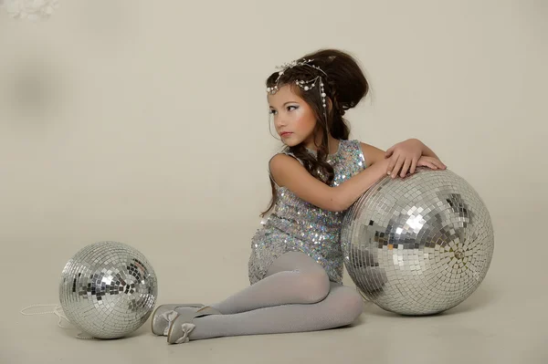 Portrait of a beautiful young girl in silver dress — Stock Photo, Image