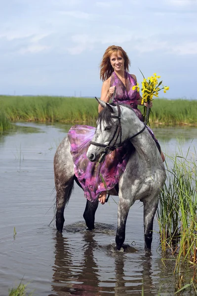 Girl with a horse — Stock Photo, Image