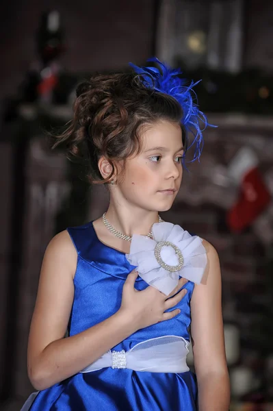 Portrait of a beautiful girl in a blue dress — Stock Photo, Image