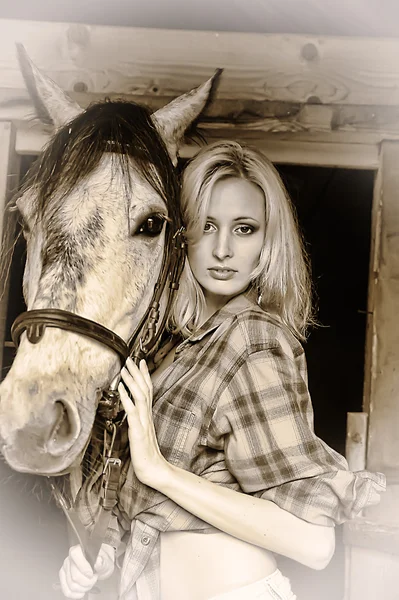 Sexy blonde with a horse — Stock Photo, Image