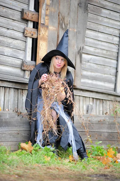 Girl in a witch costume — Stock Photo, Image