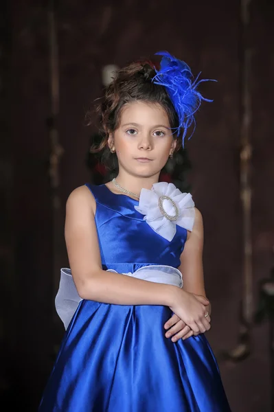 Girl in a smart blue dress — Stock Photo, Image