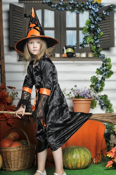 Girl in witch costume on Halloween — Stock Photo, Image