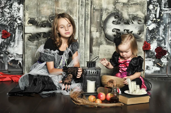 Girls in a suit of a witch — Stock Photo, Image