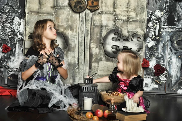 Girls in a suit of a witch — Stock Photo, Image