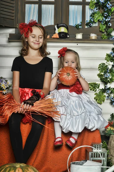 Girls in a suit of a witch — Stock Photo, Image