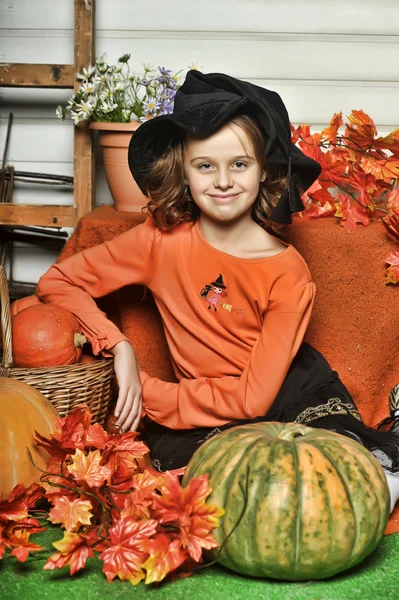 Girl with pumpkins — Stock Photo, Image