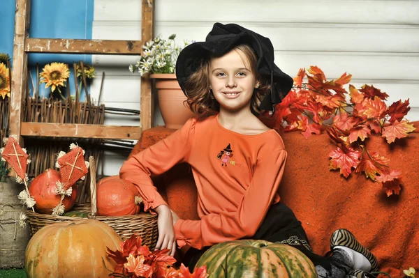 Girl with pumpkins — Stock Photo, Image