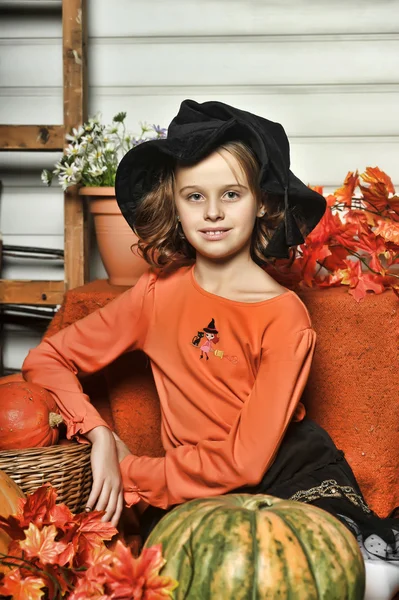 Girl with pumpkins — Stock Photo, Image