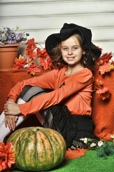 Girl with pumpkins — Stock Photo, Image