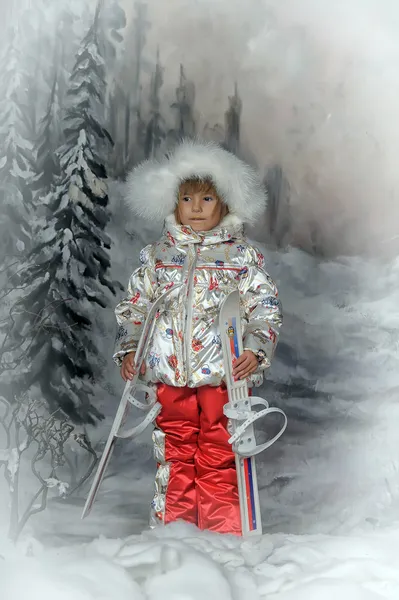 Little girl with skis in hand — Stock Photo, Image