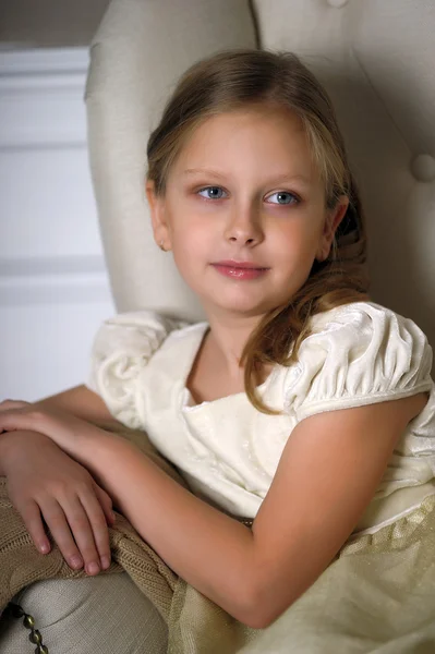 Pretty girl on sofa — Stock Photo, Image