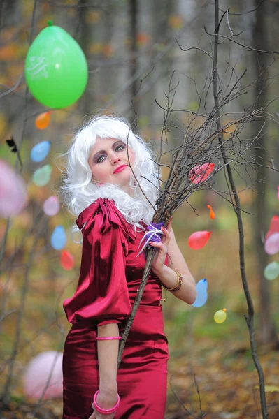 Beautiful young woman in the image of the witch in the woods on Halloween. — Stock Photo, Image