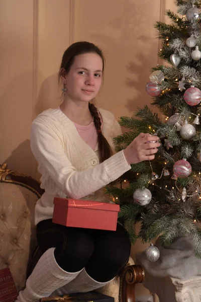 Teenage Girl Christmas Tree Hangs Toys — Stock Photo, Image
