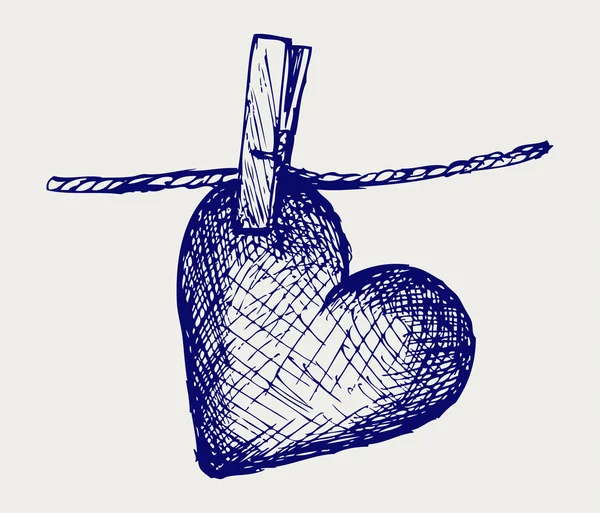 Corazón en tendedero — Vector de stock