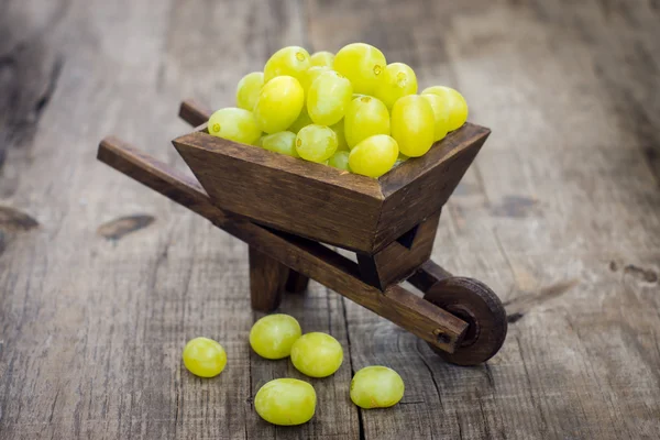Fresh Green Grapes in a wheelbarrow — Stock Photo, Image