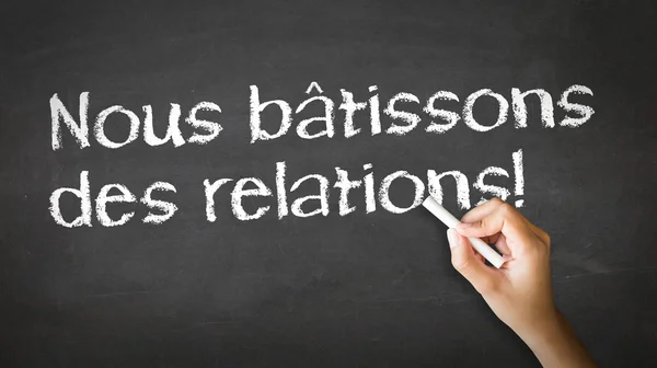 We Build Relationships (In French) — Stock Photo, Image