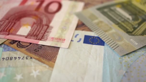 Rachunki za euro i słowo sukces napisane na hiszpański — Wideo stockowe