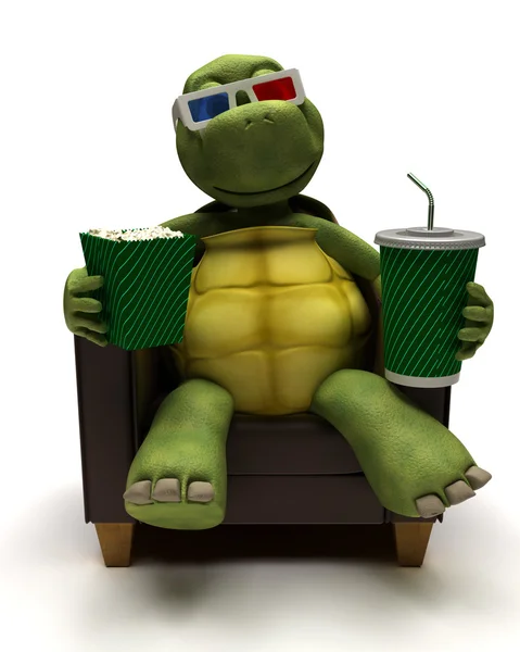 Relexing χελώνα σε πολυθρόνα πίνοντας μια σόδα βλέποντας ένα 3d ταινία — Φωτογραφία Αρχείου