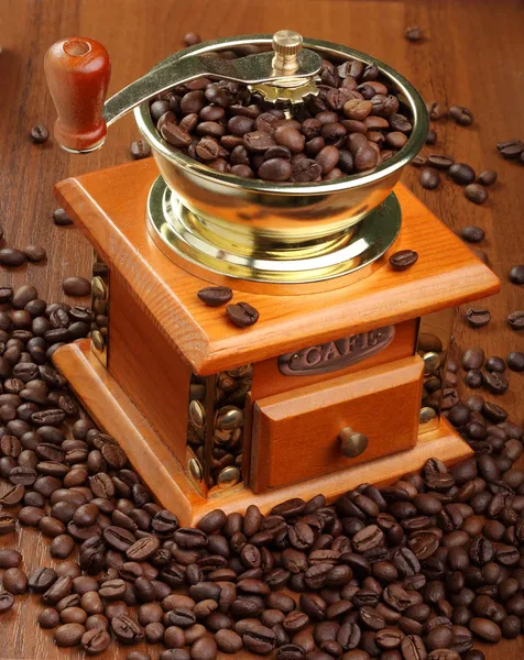 Grinder with grains of coffee — Stock Photo, Image