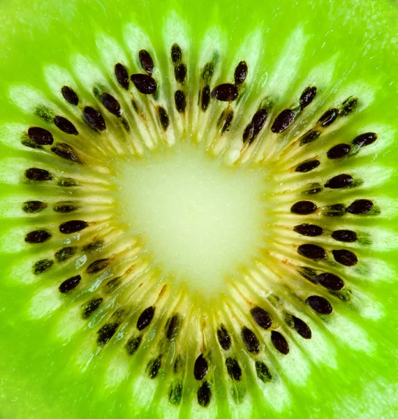 Kiwi rebanada primer plano de fondo —  Fotos de Stock