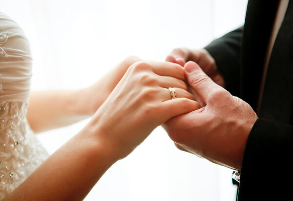 Wedding theme, newlyweds holding hands