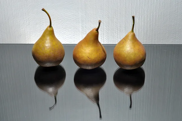 Three brown pears — Stock Photo, Image