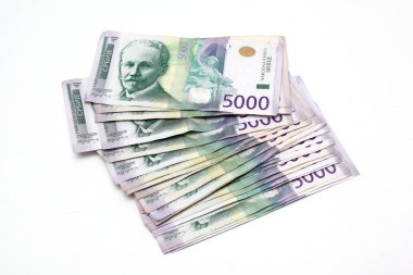 Serbian Currency - A Heap of 5000 Dinar Banknotes clipart