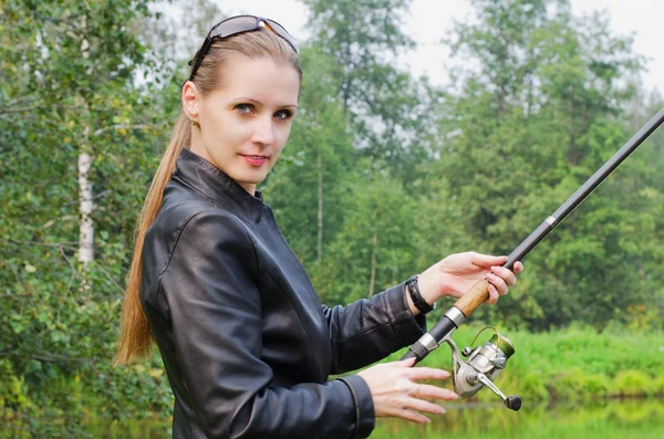 The beautiful young woman on fishing — Stock Photo, Image