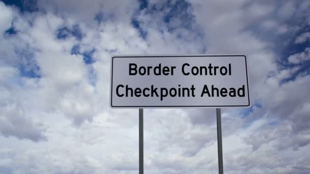 Timelapse Moln Med Vägskylt Som Säger Border Control Checkpoint Ahead — Stockvideo