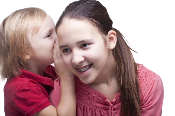 Niño y niña sobre un fondo blanco — Foto de Stock