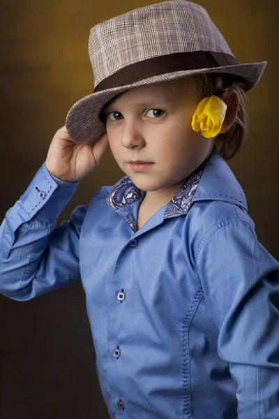 Boy with hat and flower — Stock Photo, Image