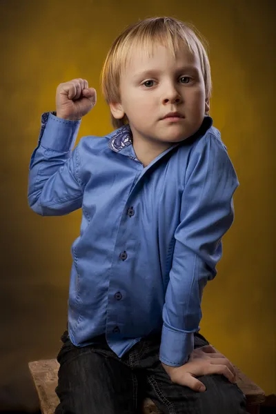 Boy threatens a fist — Stock Photo, Image