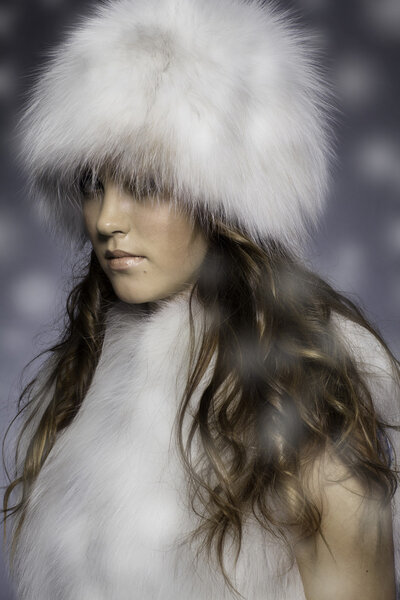 girl in fur hat and vest