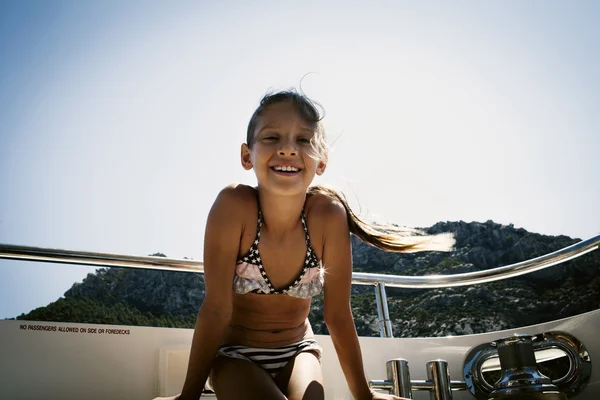 Positive small girl on a yacht — Stock Photo, Image