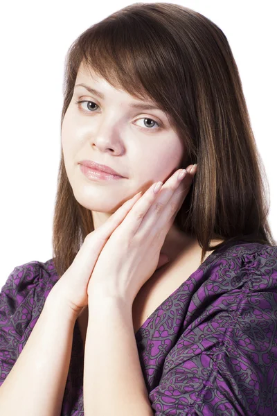 Portrait of young woman with hands near her face — Stock Photo, Image